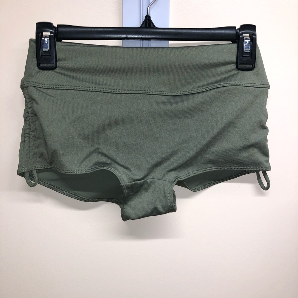 Sage green swim shorts with tie pulls on each side